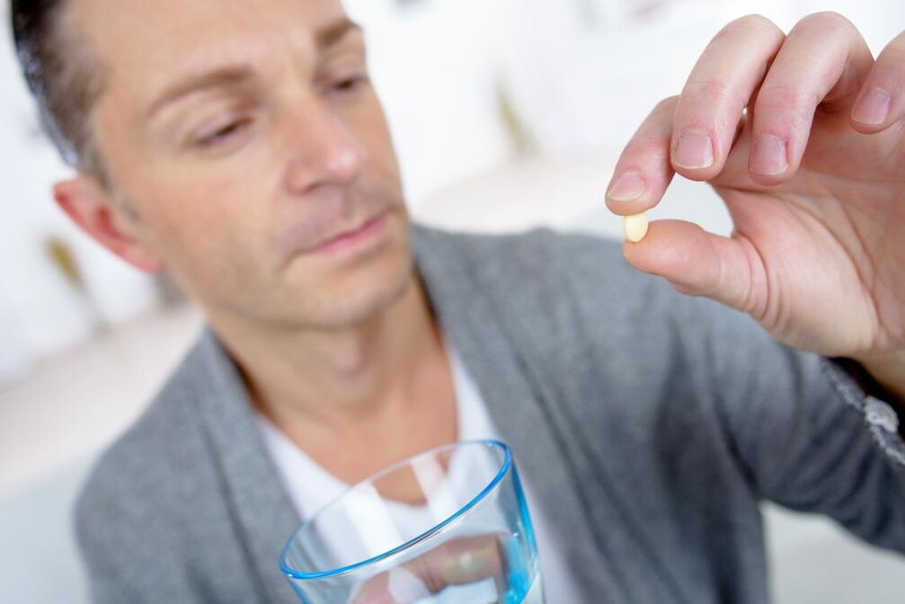 A man takes pills to increase potency