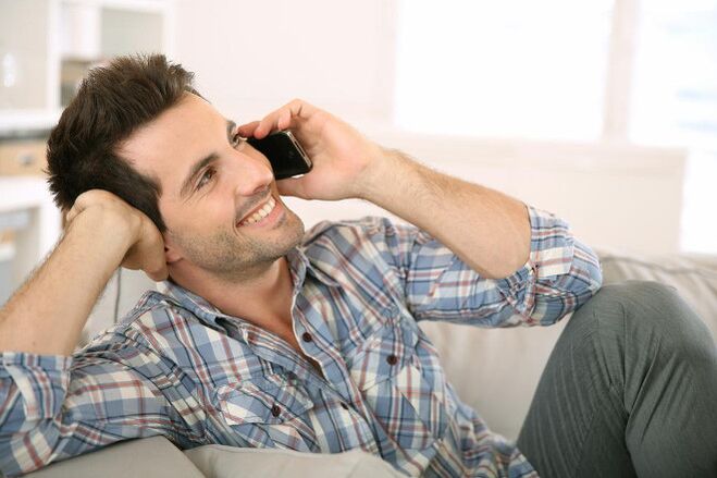 Feeling excited, a man talks to a woman on the phone for a long time